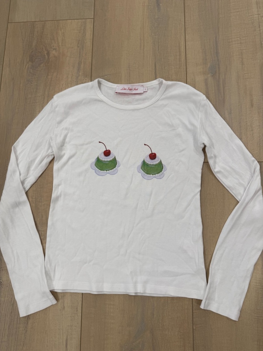Lisa Says Gah White Long-Sleeve Tee with Green Cherry Cupcake Motifs